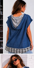 Woman wearing a blue sleeveless top with plaid trim in two different settings.
