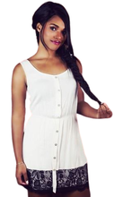 Boldly sophisticated, this elegant dress is sure to get you noticed. The classy design features a lace trim bottom with an easy-to-time button up closure on a gathered waistline.- Shop Canary Clothing