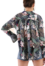 Navy Blue Tropical Print Collared Button Up Top with Long Bell Sleeves light weight fabric perfect for a summer day. Style tied in the front, as a cover up, or with a pair of shorts. Shop Canary Clothing