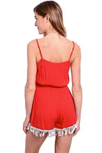 This red and white spaghetti strap woven romper has a contrast colored embroidered design along center front, gathered waist and tassel trim hem. - Shop  Canary Clothing