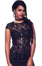 This black sheer lace top features a peplum detail, a round neckline and short sleeves - Shop Canary Clothing