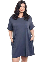 Simple and comfortable pocket t-shirt dress. This plus size dress has a flattering scoop neck and sleeveless design, making it perfect for any occasion. Layer it over leggings for a casual look, or wear it with heels for a more elegant style.- Shop Canary Clothing