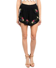 Black flounce shorts features multicolored floral embroidery and high waisted smocked waist - Shop Canary Clothing