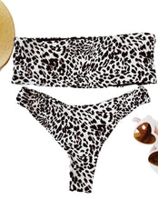 Bandeau Cheetah Print Tube Top Thong Bikini. Features a strapless bandeau top with padded cups. Thong swim bottoms in a high cut leg design - Shop Canary Clothing