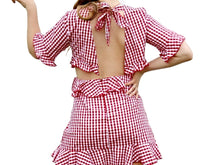 Ready for a picnic with this Red and white gingham dress. Style this with some white sneakers or your favorite wedge sandals -  Shop Canary Clothing