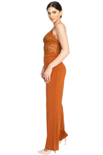An elegant jumpsuit like this is what you need to party!  Spicy cognac orange color jumpsuit featuring a lace floral crochet. Solid wide-cut leg bottoms. Sleeveless. Zipper on the back. No pockets. V-Neckline. Just add some strappy heels for a classy but sassy look.  95% Polyester, 5% Spandex- Shop Canary Clothing