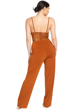 An elegant jumpsuit like this is what you need to party!  Spicy cognac orange color jumpsuit featuring a lace floral crochet. Solid wide-cut leg bottoms. Sleeveless. Zipper on the back. No pockets. V-Neckline. Just add some strappy heels for a classy but sassy look.  95% Polyester, 5% Spandex- Shop Canary Clothing